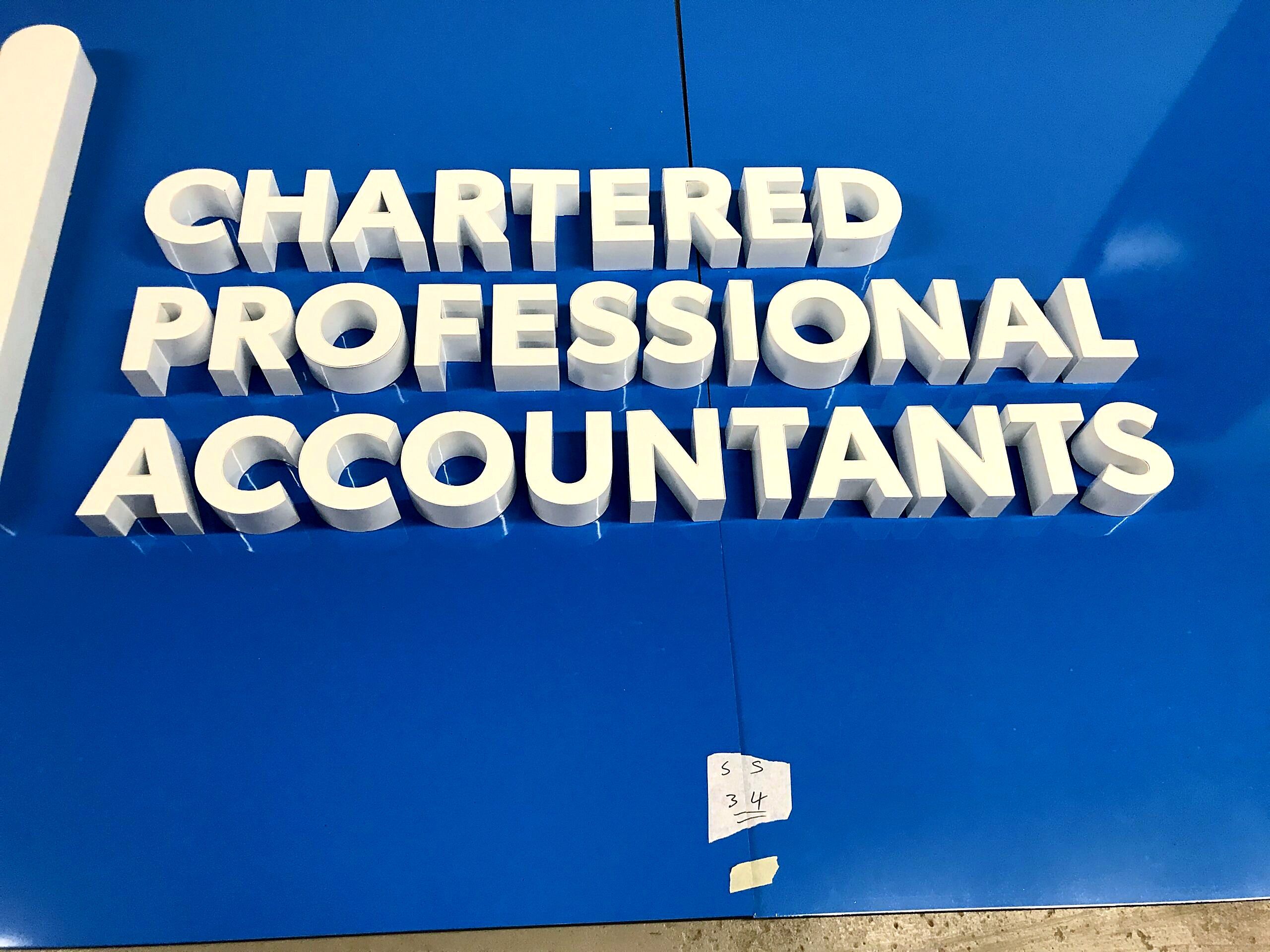Close-up of raised white letters reading Chartered Professional Accountants