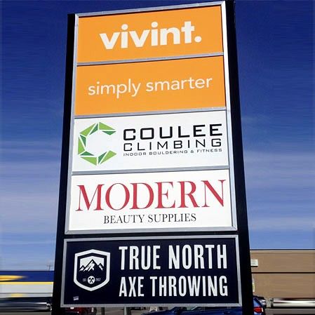 Pylon sign with panels for Vivint, Coulee Climbing, Modern Beauty Supplies and True North Axe Throwing